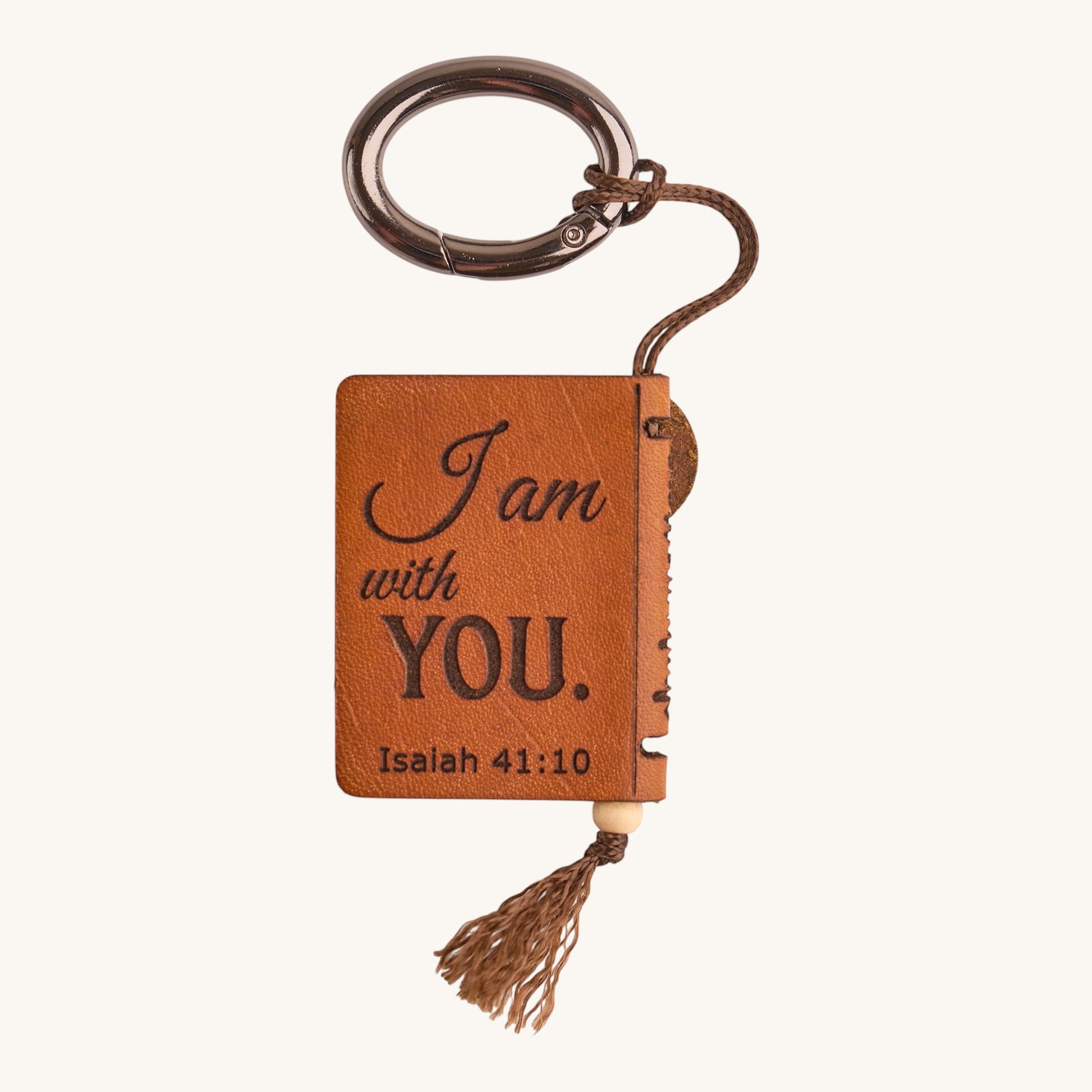 Holy Matters vegetable-tanned leather mini Bible keepsake keychain engraved with Isaiah 41:10 and a brown tassel.