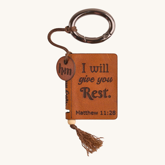 Holy Matters vegetable-tanned leather mini Bible keepsake with Matthew 11:28 engraving and brown tassel keychain