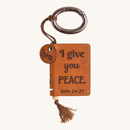 Holy Matters handcrafted vegetable-tanned leather mini Bible keepsake with John 14:27 scripture and metal keyring
