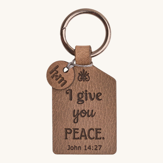 Holy Matters handcrafted vegetable-tanned leather keychain tag engraved with John 14:27 peace scripture