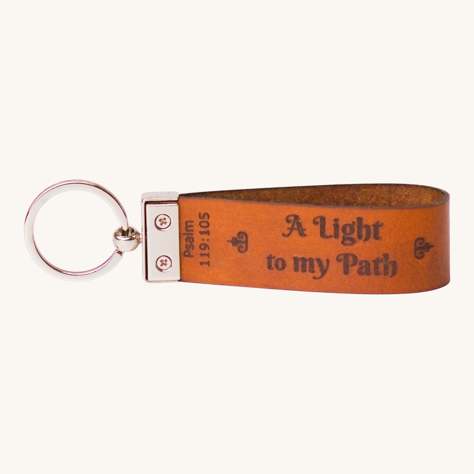 Holy Matters vegetable-tanned leather keychain engraved with Psalm 119:105 A Light to my Path text
