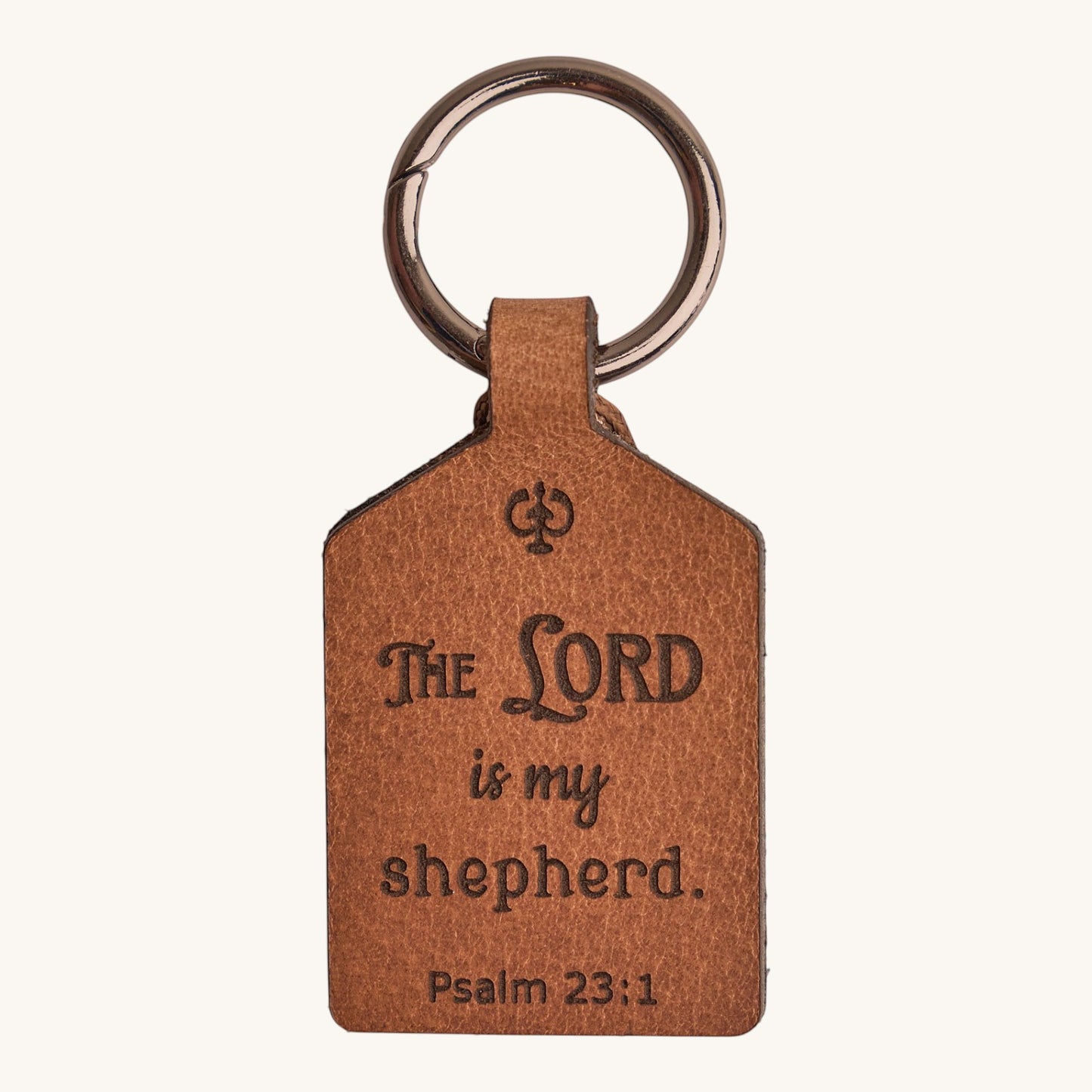 Holy Matters vegetable-tanned leather keychain engraved with Psalm 23:1 The Lord is my shepherd text.