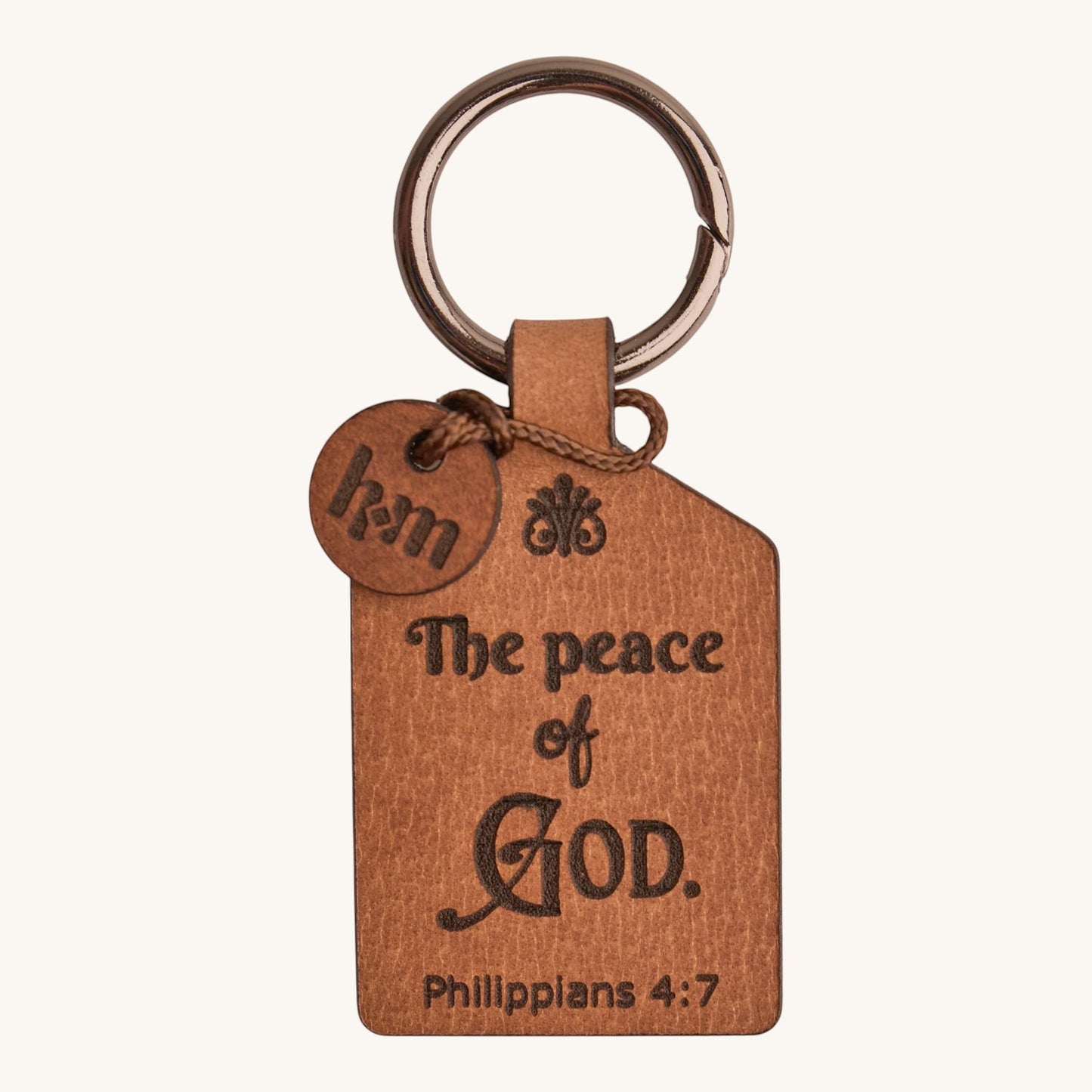 Holy Matters handcrafted vegetable-tanned leather keychain engraved with Philippians 4:7 scripture