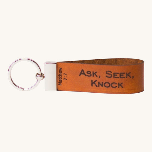 Holy Matters handcrafted vegetable-tanned leather keychain embossed with Matthew 7:7 Ask, Seek, Knock scripture.