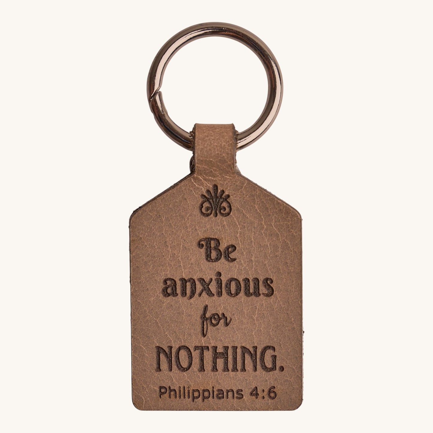 Holy Matters handcrafted vegetable-tanned leather keychain engraved with Philippians 4:6 scripture