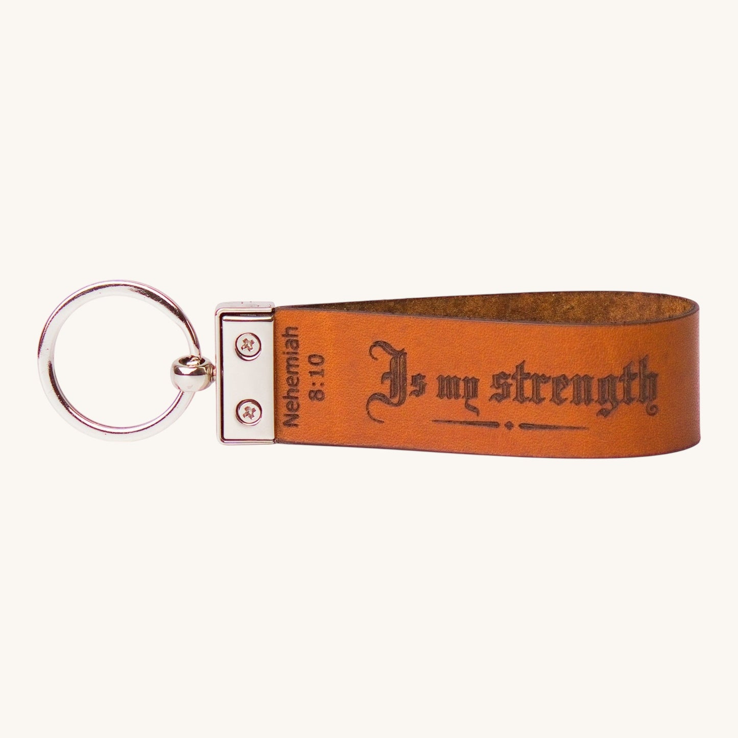 Holy Matters handcrafted vegetable-tanned leather keychain engraved with Nehemiah 8:10 Is my strength scripture