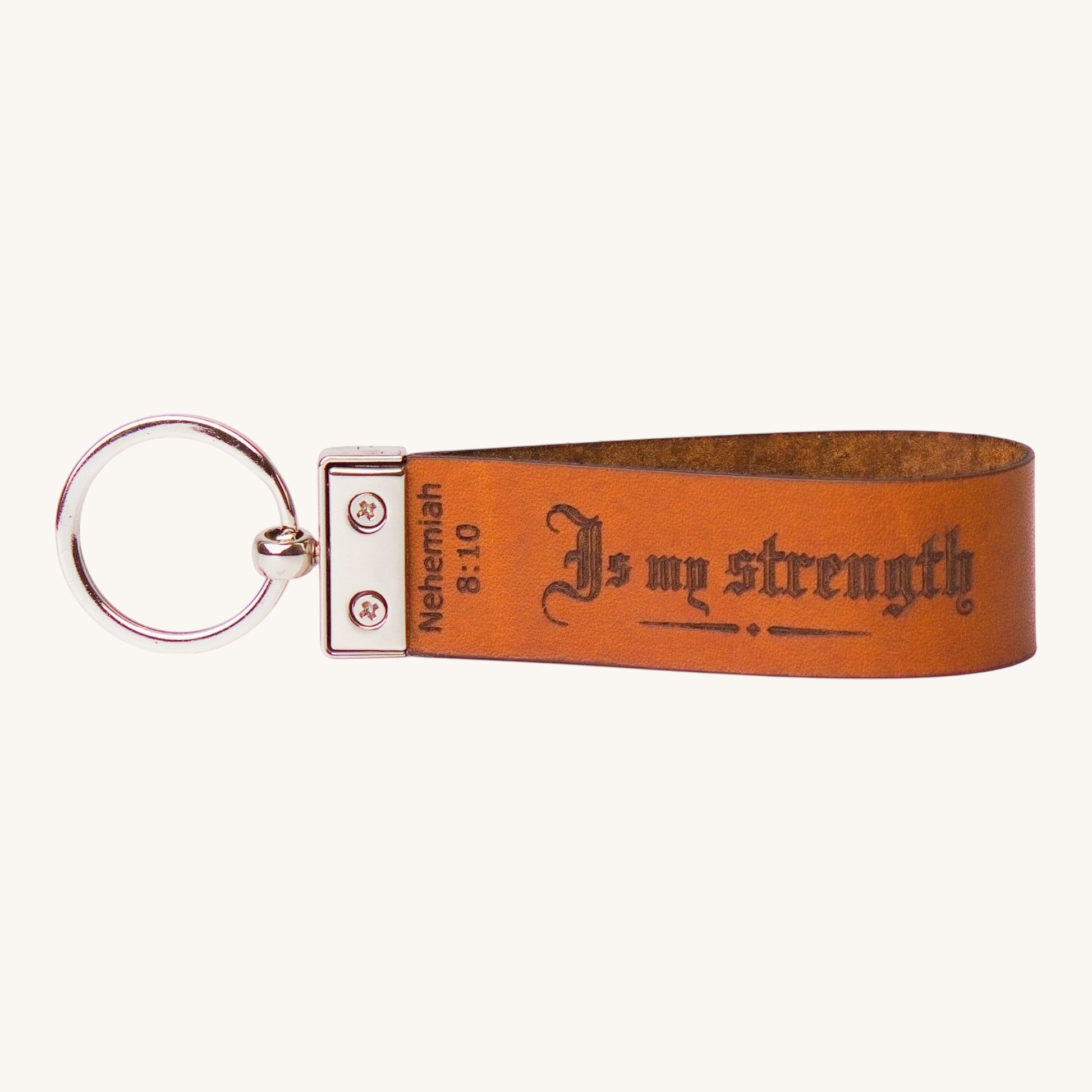 Holy Matters handcrafted vegetable-tanned leather keychain engraved with Nehemiah 8:10 Is my strength scripture
