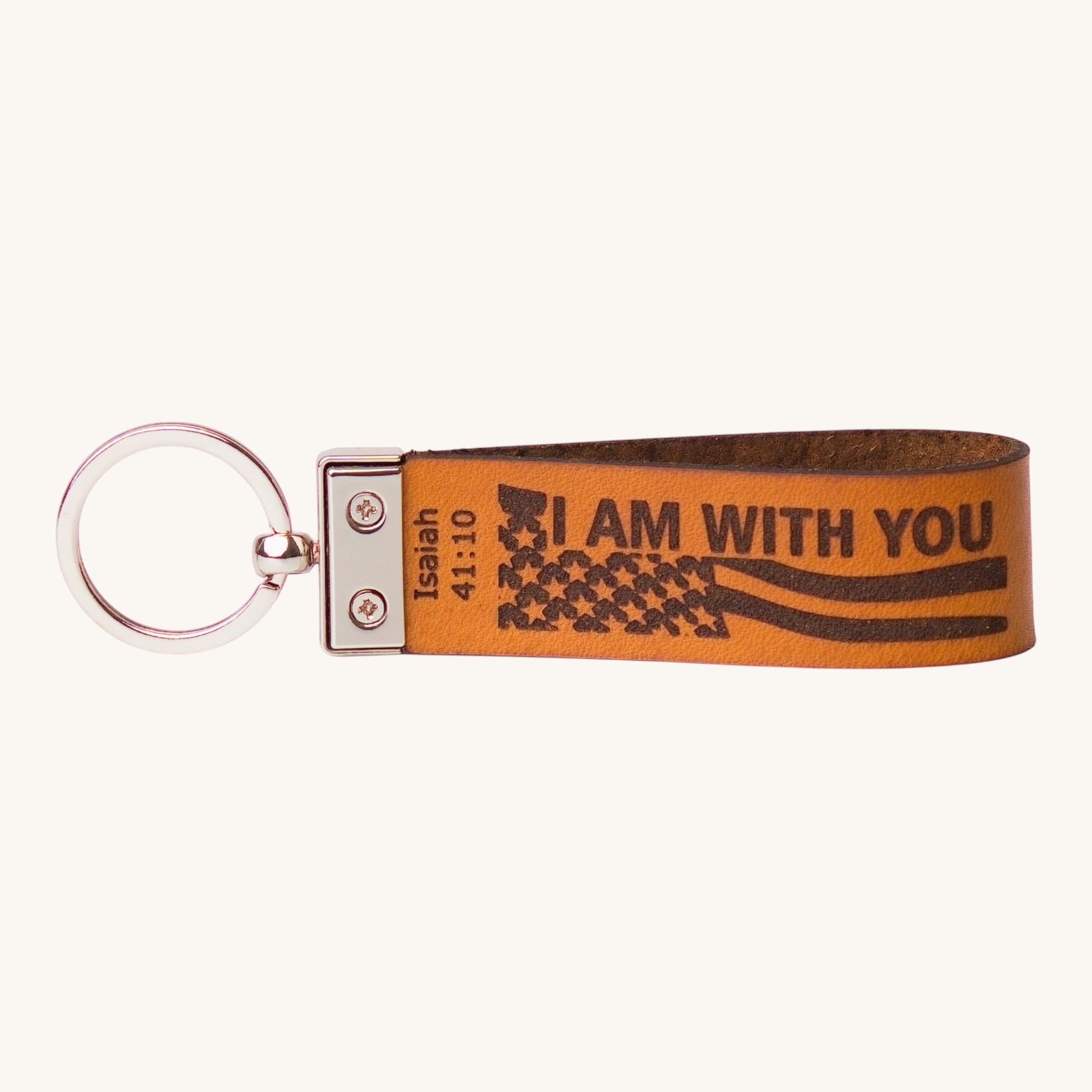 Holy Matters vegetable-tanned leather keychain engraved with Isaiah 41:10 Scripture and a flag design
