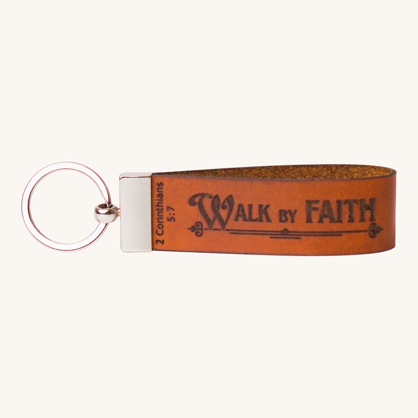 Holy Matters handcrafted tan vegetable-tanned leather keychain embossed with Walk by Faith 2 Corinthians 5:7 scripture