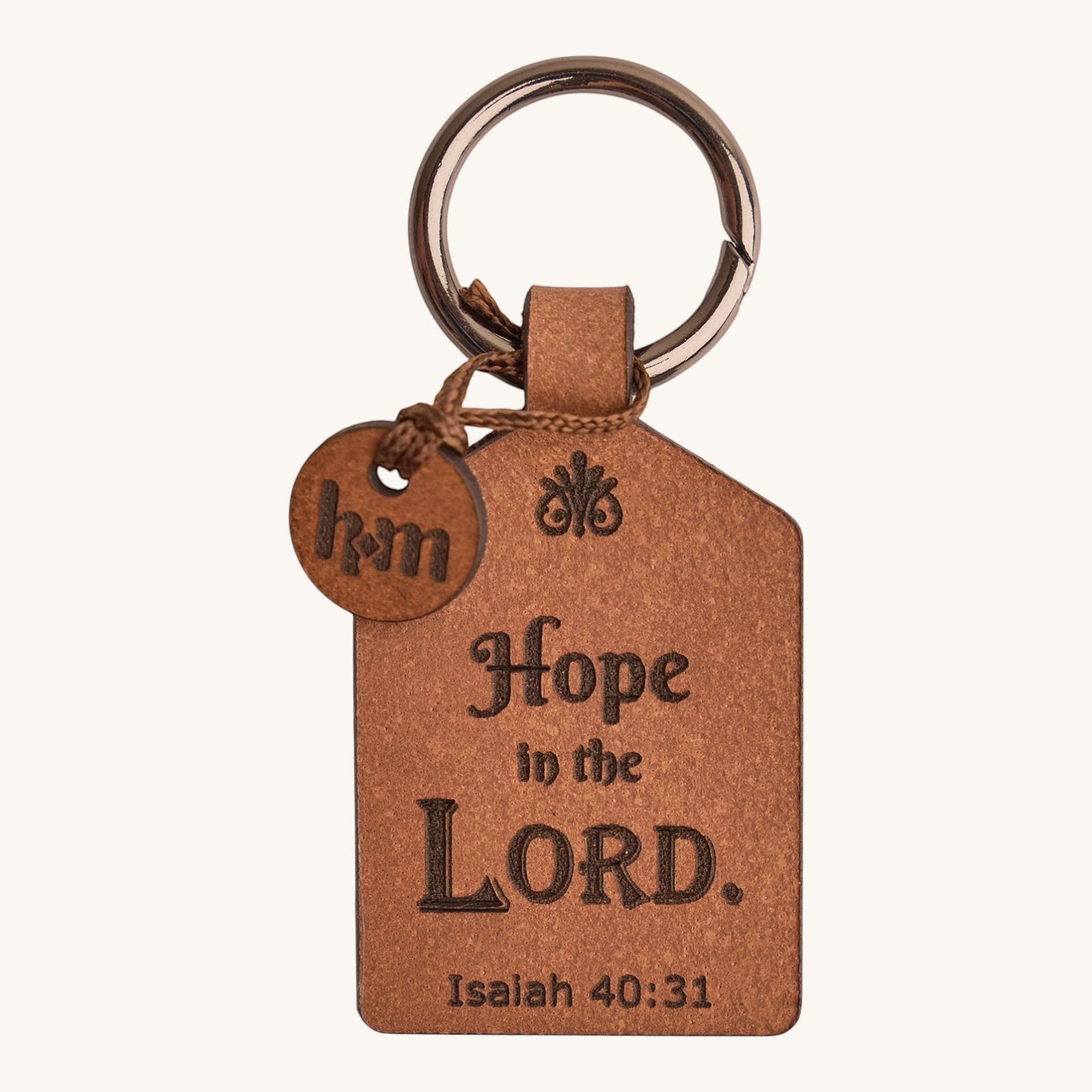 Holy Matters handcrafted vegetable-tanned leather keychain tag engraved with Isaiah 40:31 Scripture
