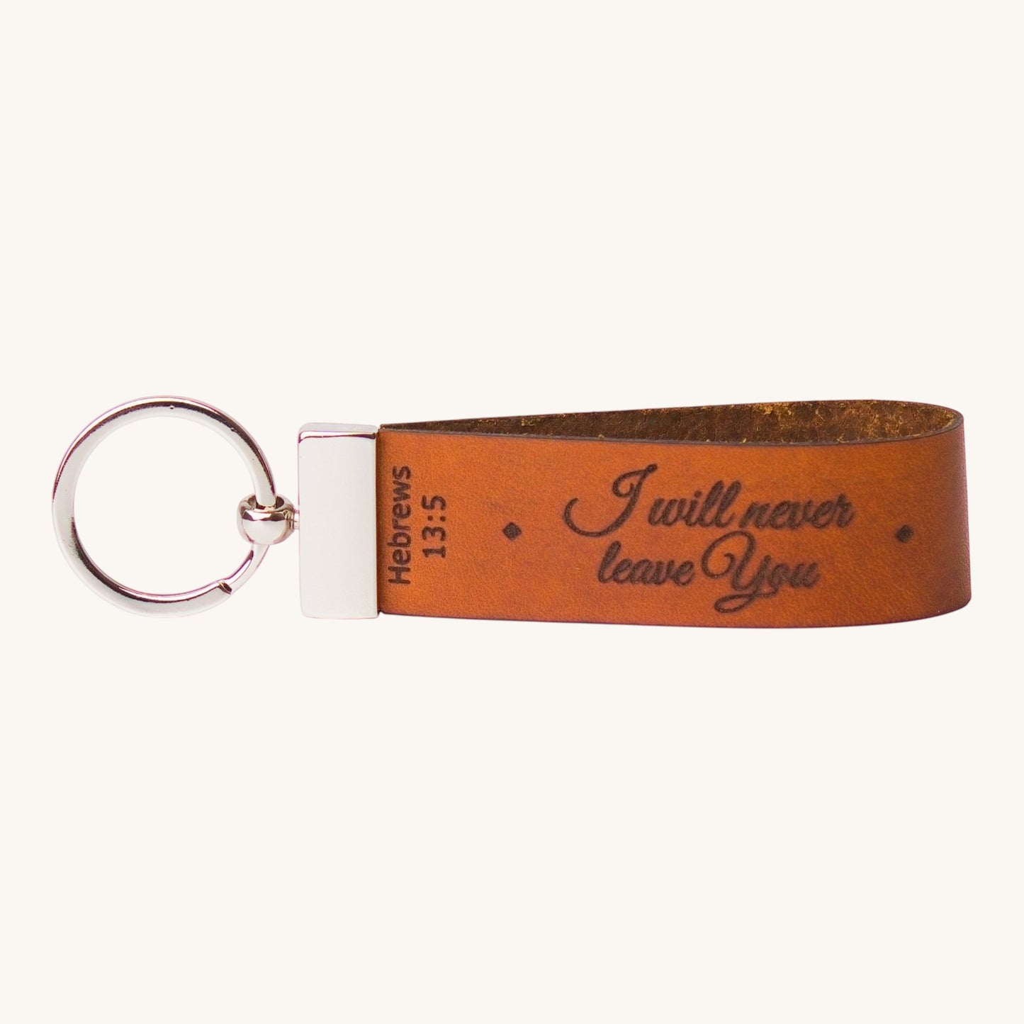 Holy Matters vegetable-tanned leather keychain engraved with Hebrews 13:5 scripture in elegant cursive script.