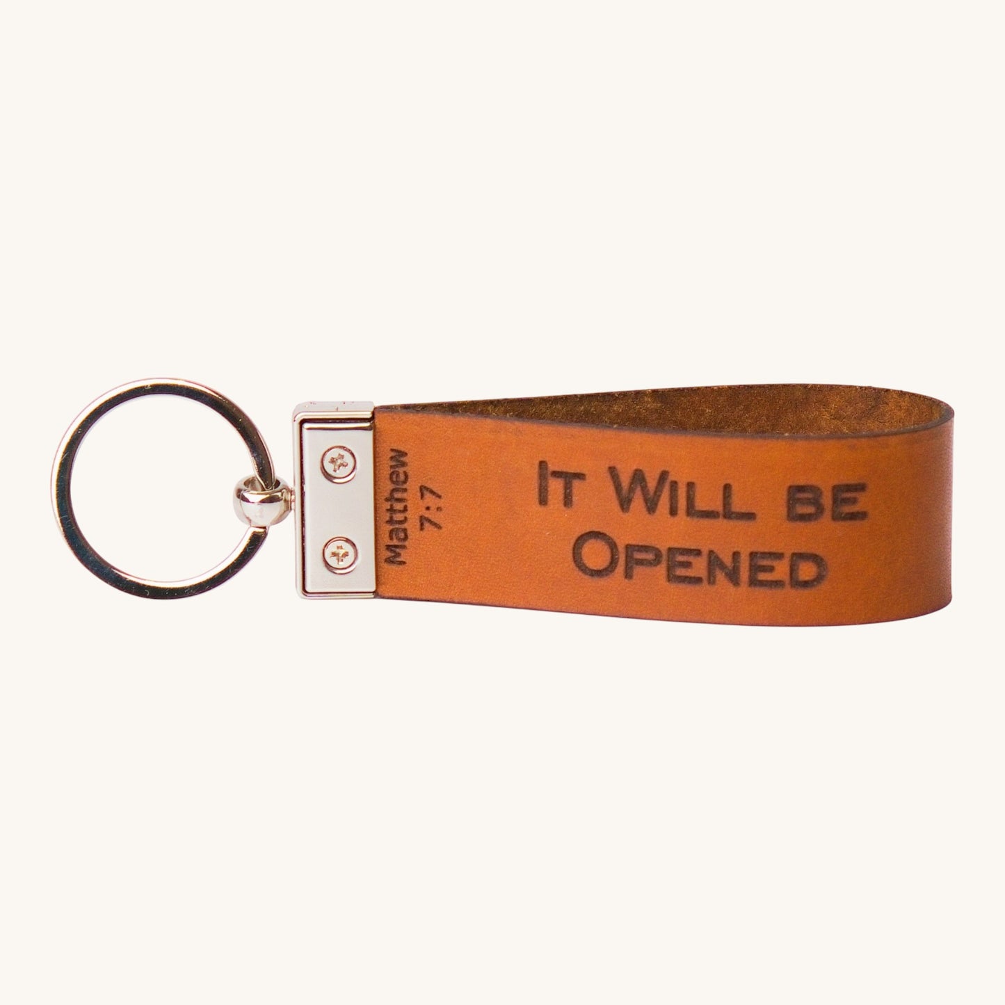 Holy Matters vegetable-tanned leather keychain embossed with Matthew 7:7 scripture It Will Be Opened